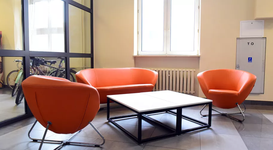 Orange chairs in the dormitory.